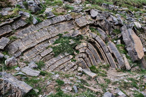 Remains of plates of stones or minerals superimposed, as an example for geology.