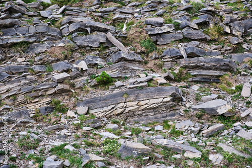 Remains of plates of stones or minerals superimposed, as an example for geology.