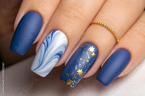 Elegant matte blue nails with marble and star accents