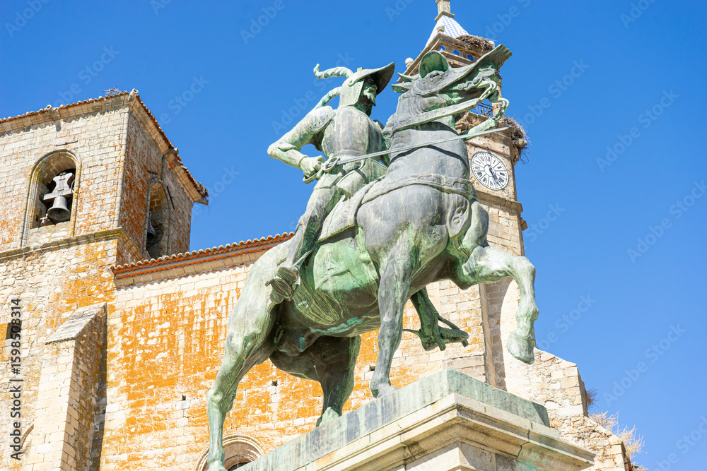 Fototapeta premium Equestrian monument of heroic figure in Trujillo, Extremadura at midday under a clear blue sky