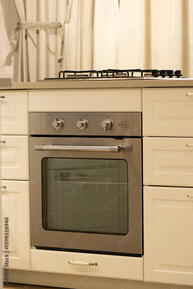 Fototapeta premium Classic built-in stainless oven in white shaker kitchen