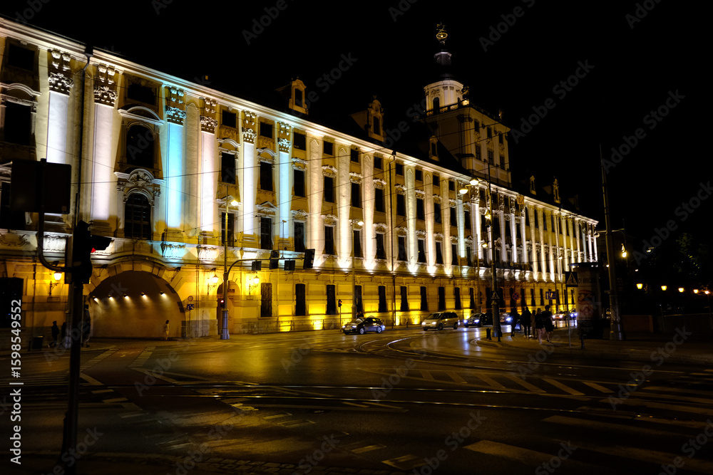 Fototapeta premium Historic building with bright facade and night lighting.