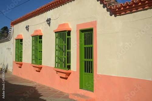 Sometimes modern and thriving, sometimes rural and colonial, houses made from the same land still prevail, as well as the modern use of concrete.