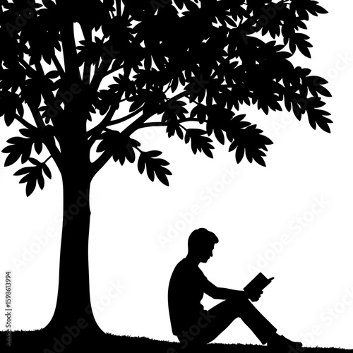 Young man reading a book under a tree in silhouette  