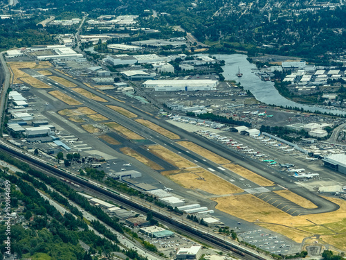 Seattle / Tukwila, King County, WA, USA, aerial view of King County International Airport, commonly Boeing Field with runways, Boeing manufacture buildings and many Boeing airplanes parked 