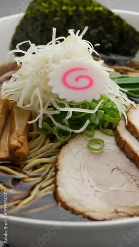 Authentic Japanese Ramen with Rich Broth, Noodles, Soft-Boiled Egg, and Toppings – Steaming Hot Bowl of Comfort Food with Pork, Seaweed, and Scallions.