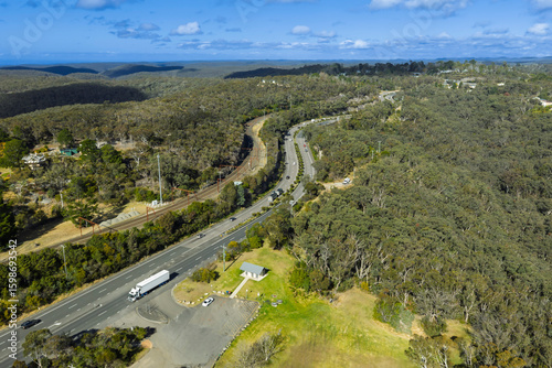 Drone aerial photograph of the Great Western Highway and nearby Railway Line adjacent to Bulls Camp Reserve near Woodford in the Blue Mountains, NSW, Australia.