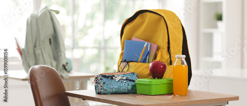 Apple with lunchbox, pencil...