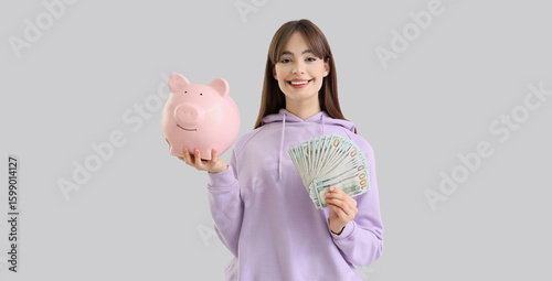 Young woman with dollar ban...