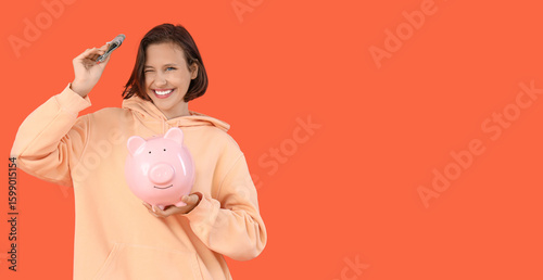 Happy young woman holding m...