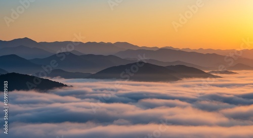 Serene Mountain Peaks Above Sea of Clouds at Sunrise