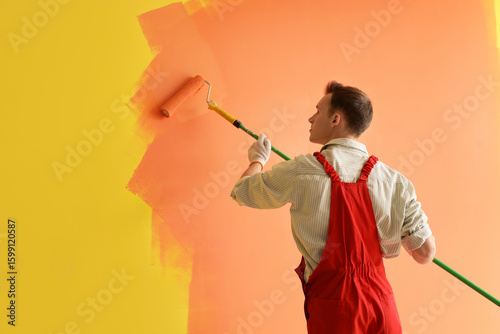 Professional painter applyi...