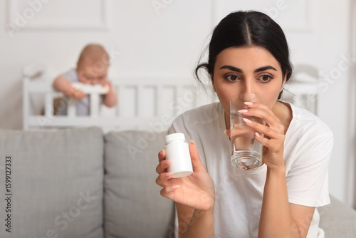 Young mother suffering from...