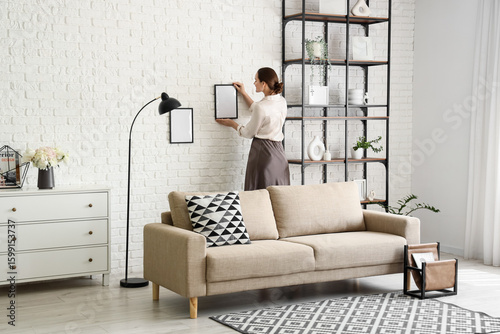 Woman decorating modern liv...