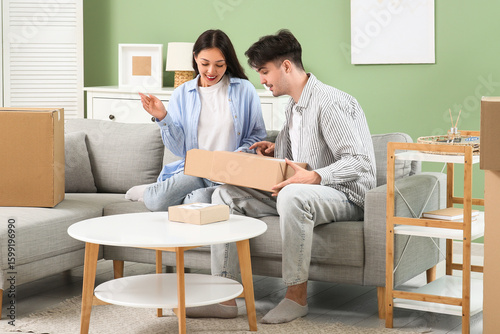 Young couple with parcel bo...
