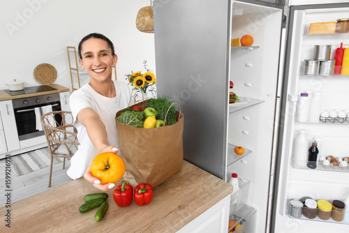 Young woman with bag of foo...