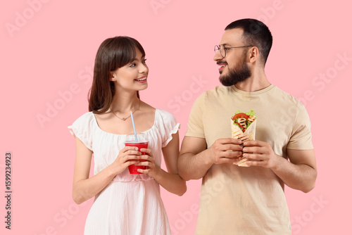 Young couple with tasty san...