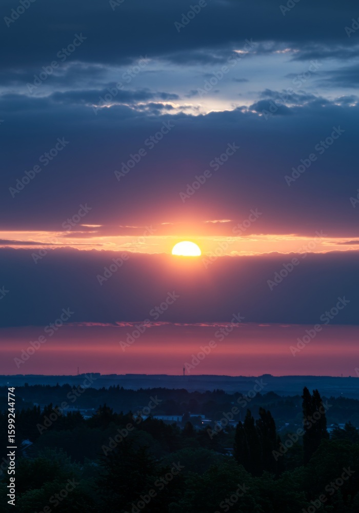 Fototapeta premium Vibrant Sunset Landscape with Purple and Orange Clouds