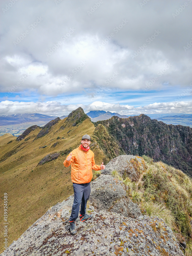 Obraz premium Pichincha Province, Quito, Ecuador - July 5, 2025: Tourist at the summit of Pasochoa Volcano, located in the Pasochoa Wildlife Refuge. The extinct volcano is 4,200 meters high.