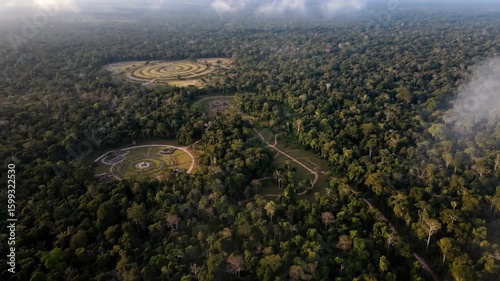 An aerial view captures the enigmatic geoglyphs of acre, brazil, nestled within the lush amazon rainforest, revealing ancient earthworks and prehistoric civilizations amidst the dense jungle