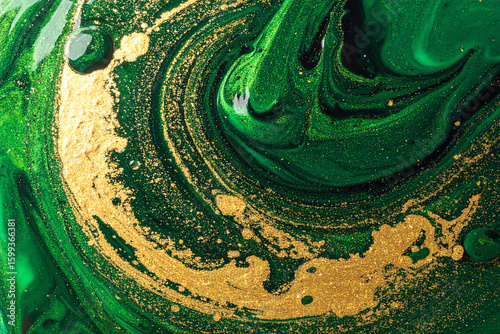 alcohol ink vintage design with gold accents and a green wavy surface texture background