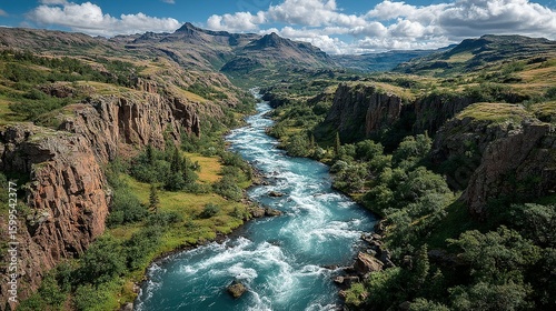 Scenic river flowing through a valley with steep cliffs.