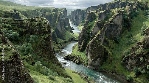 Lush valley with a winding river and dramatic rock formations.