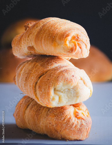 Golden Flaky Pastries Stacked for Bakery Display