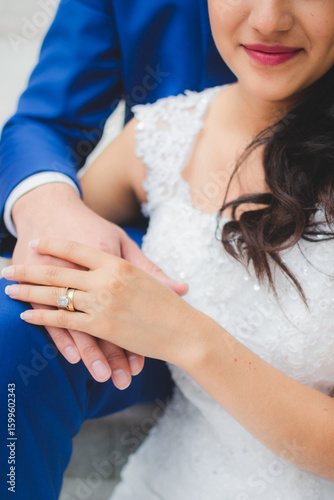 bride and groom holding hands