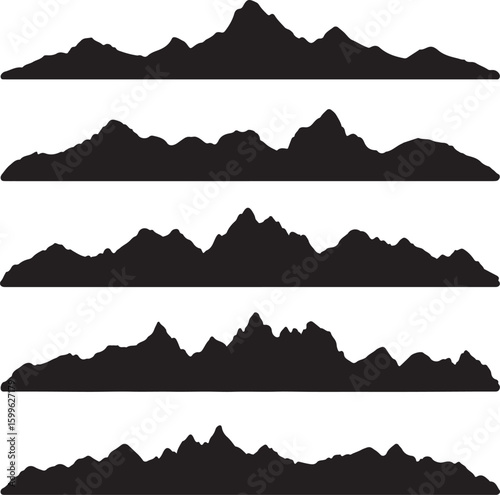 Jagged mountain ranges crests peaks and valleys silhouette