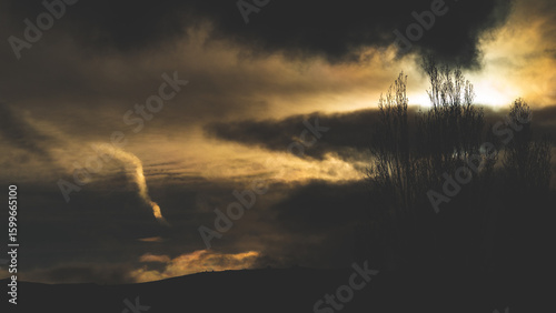 Fotografija winter gloomy dark landscape views mountains hills through fog and trees cromwel
