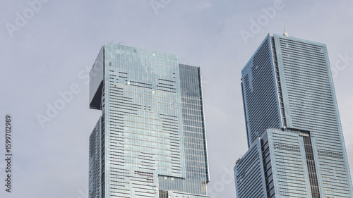 view of a public park with a lake in Jakarta in the morning with a background of modern buildings on the lake side