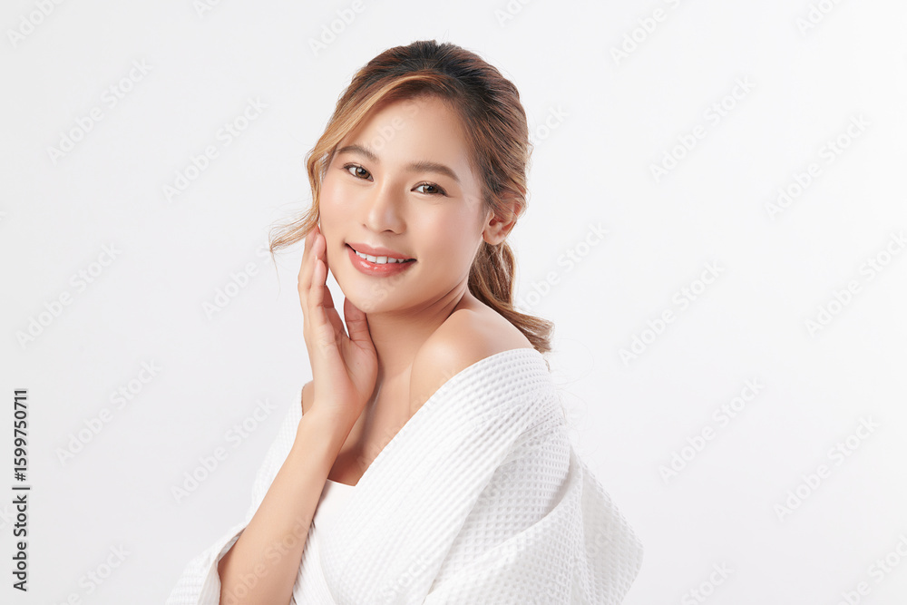 A beautiful young Asian woman with clean, fresh skin against a white background. Skincare, facial treatment, cosmetology, beauty, and spa. An elegant portrait of an Asian woman. A beautiful young Asian woman with clean, fresh skin against a white background. Skincare, facial treatment, cosmetology, beauty, and spa. An elegant portrait of an Asian woman.
