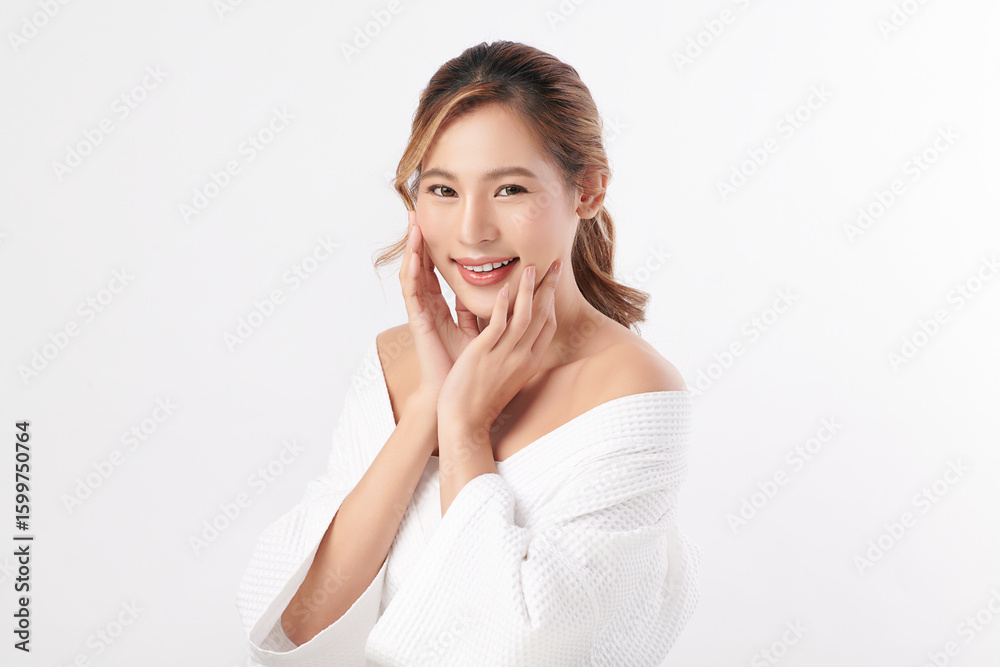 A beautiful young Asian woman with clean, fresh skin against a white background. Skincare, facial treatment, cosmetology, beauty, and spa. An elegant portrait of an Asian woman. A beautiful young Asian woman with clean, fresh skin against a white background. Skincare, facial treatment, cosmetology, beauty, and spa. An elegant portrait of an Asian woman.