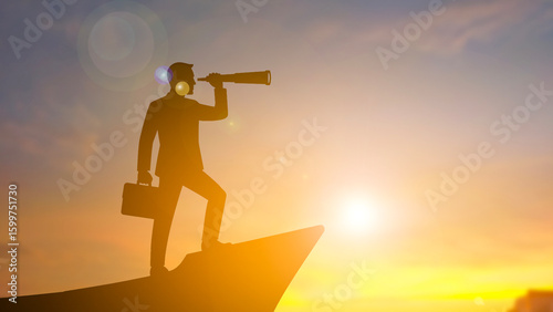 A business man stand on ship head explore by telescope