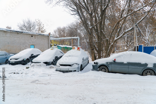 Cars covered with snow in the Parking lot