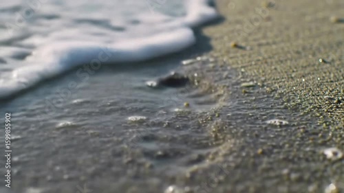 Ocean Wave Gently Washing Ashore on Sandy Beach