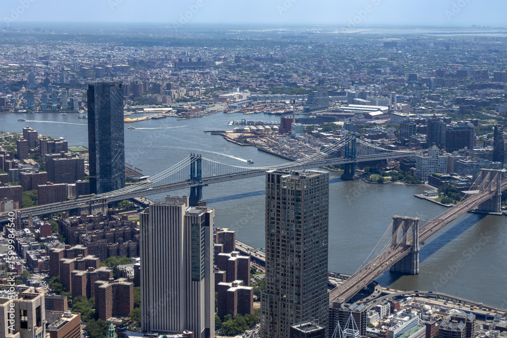 Obraz premium Aerial view of lower Manhattan Island in New York City, New York, on a sunny day