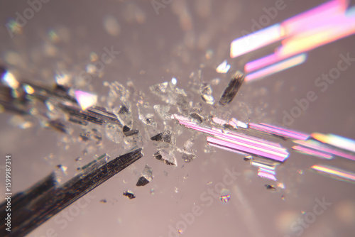Shattered glass thinly sliced reflective metal sliver abstract macro sharp fragments floating in air soft pink background dynamic futuristic energetic