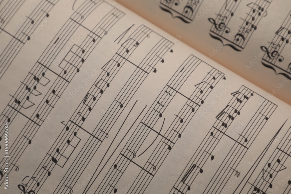 Fototapeta premium Sheets with musical notes as background, closeup