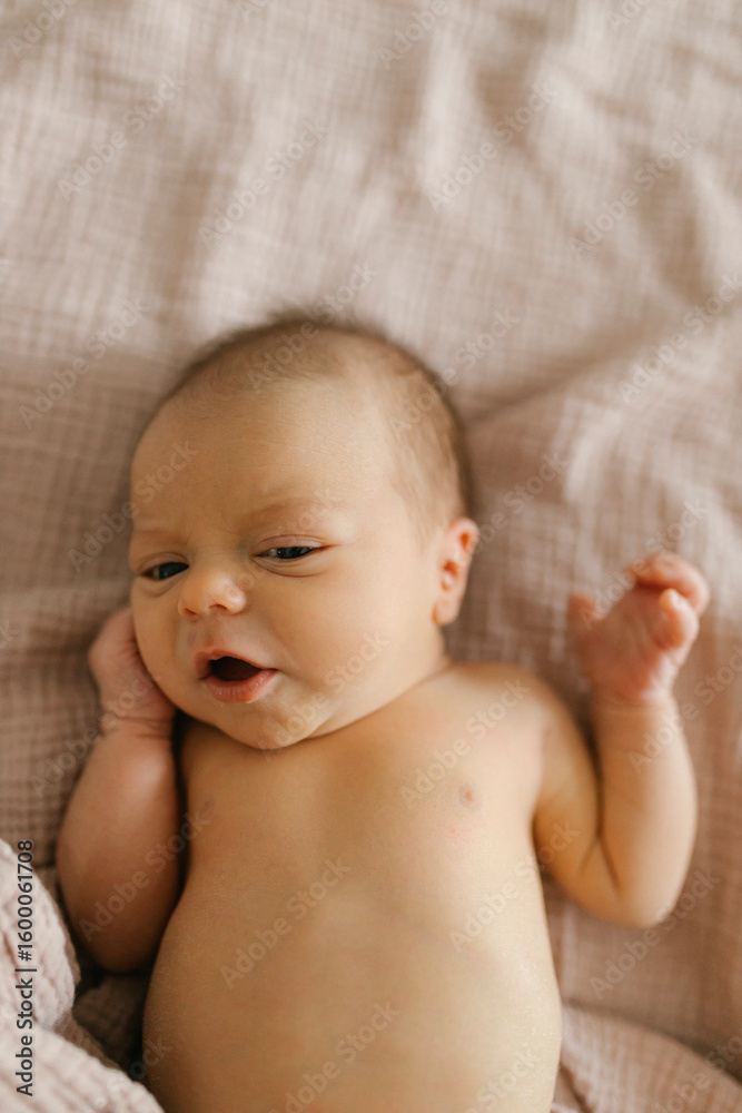 Baby lying on soft blanket symbolizing parenting and care Baby lying on soft blanket symbolizing parenting and care