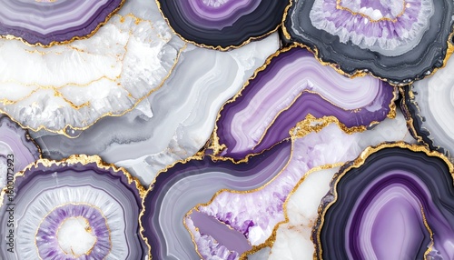 Beautiful layers of purple agate stone with gold accents displayed on a flat surface