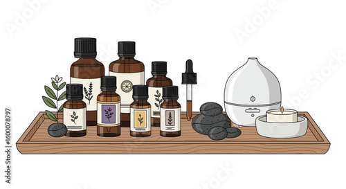 Aromatherapy essentials collection with essential oil bottles diffuser stones and candle on wooden tray