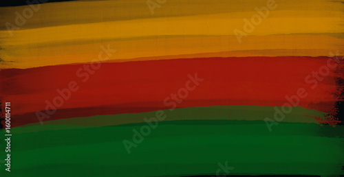 Abstract paint brush textured stripes in traditional African colors red, yellow green on black background. Black history month brush color background, african flag colors, icon of african american