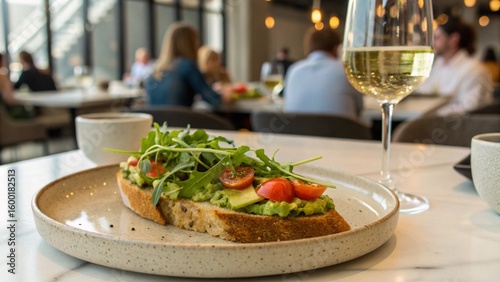 Healthy Avocado Toast with Arugula, Cherry Tomatoes, and Wine
Gourmet Brunch: Fresh Avocado and Greens on Sourdough Bread
Delicious Vegetarian Breakfast or Lunch with a Scenic View