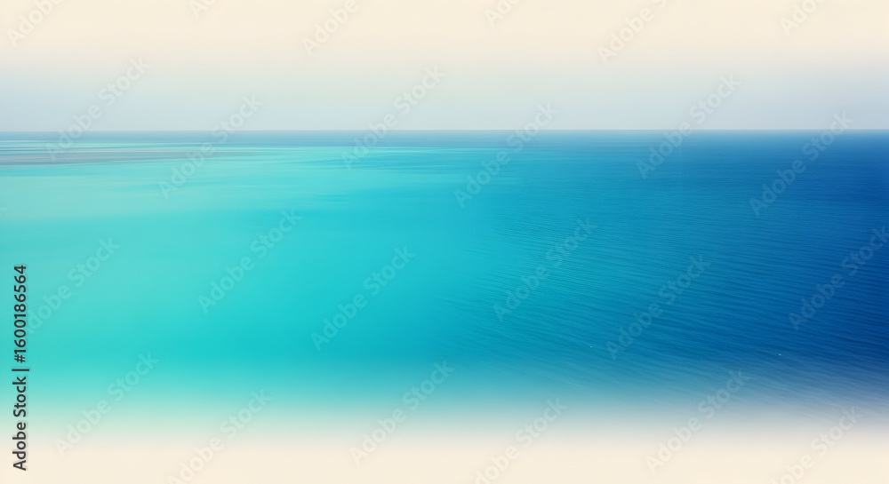 Fototapeta premium A serene view of the ocean with clear turquoise water and a light sky above horizon line