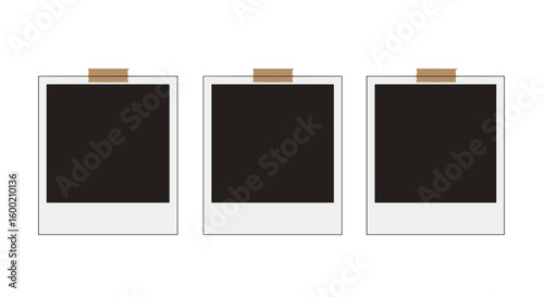 Three blank instant photo frames with tape on white background