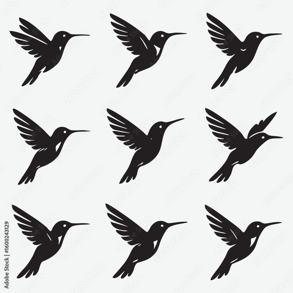 Fototapeta premium Hummingbird silhouettes in flight flying black
