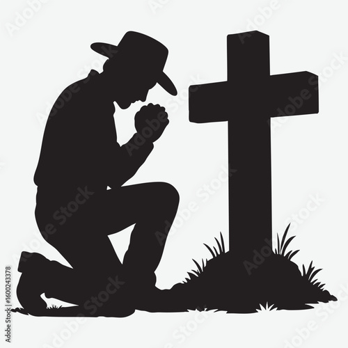 Man praying at cross silhouette kneeling religion