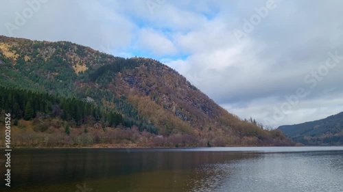 Serene Mountain Lake Landscape in Autumn with Cloudy Sky